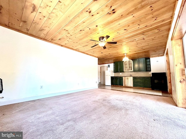 unfurnished living room with wooden ceiling, light carpet, ceiling fan, and baseboards