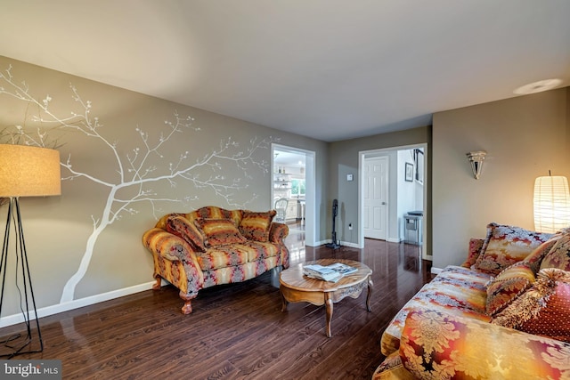 living room featuring baseboards and wood finished floors