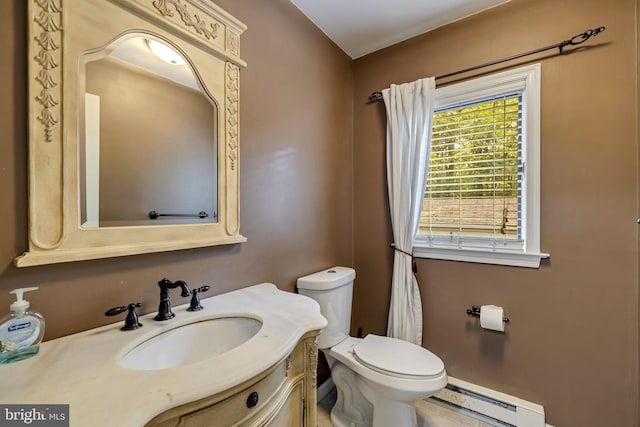 bathroom featuring baseboard heating, vanity, and toilet