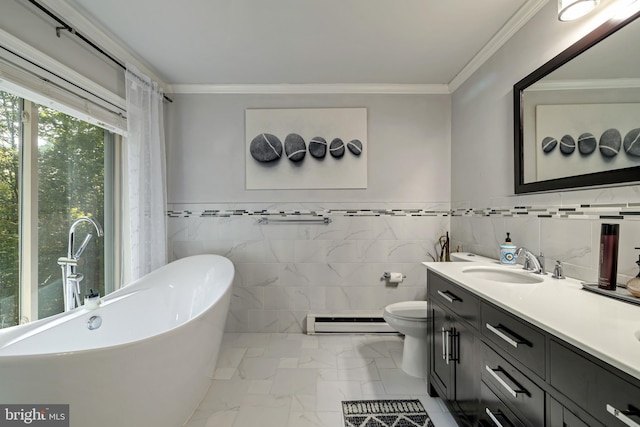 bathroom featuring a baseboard heating unit, vanity, a freestanding bath, marble finish floor, and crown molding