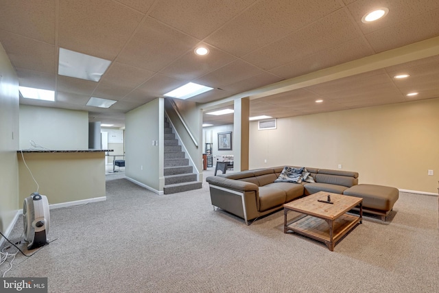 carpeted living room with stairway, recessed lighting, a paneled ceiling, and baseboards