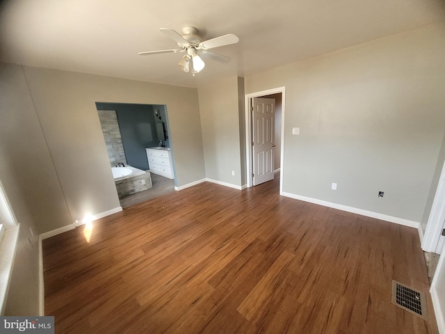 unfurnished bedroom featuring visible vents, ceiling fan, baseboards, and wood finished floors