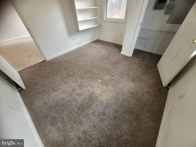 unfurnished bedroom with carpet and baseboards