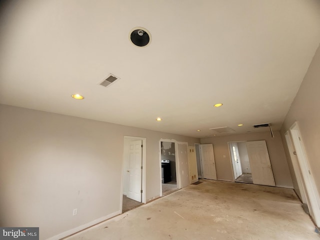 unfurnished bedroom with baseboards, connected bathroom, visible vents, and recessed lighting