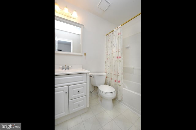 bathroom with shower / bath combination with curtain, vanity, toilet, and tile patterned floors