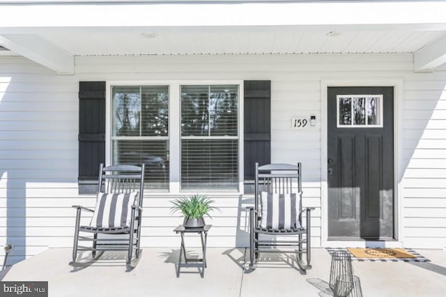 property entrance featuring covered porch