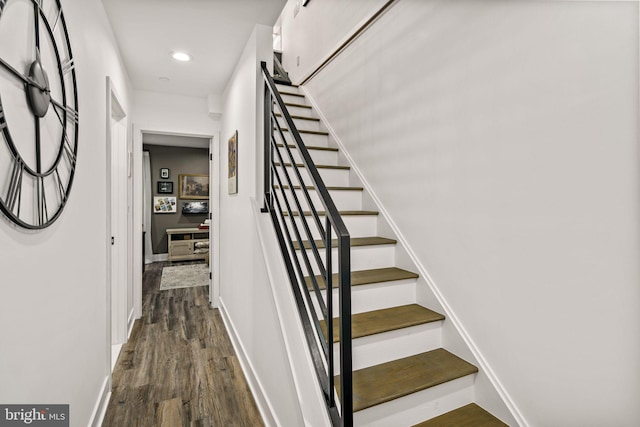 stairs featuring recessed lighting, baseboards, and wood finished floors