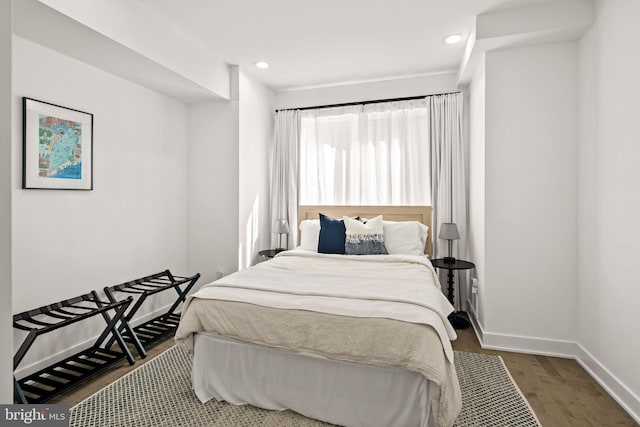 bedroom featuring recessed lighting, baseboards, and wood finished floors