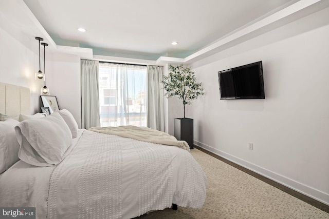 bedroom featuring recessed lighting, baseboards, and wood finished floors