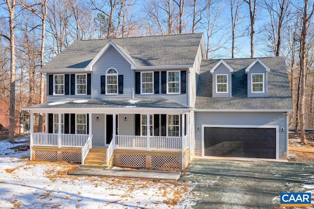 view of front of property featuring a porch, a shingled roof, an attached garage, and aphalt driveway