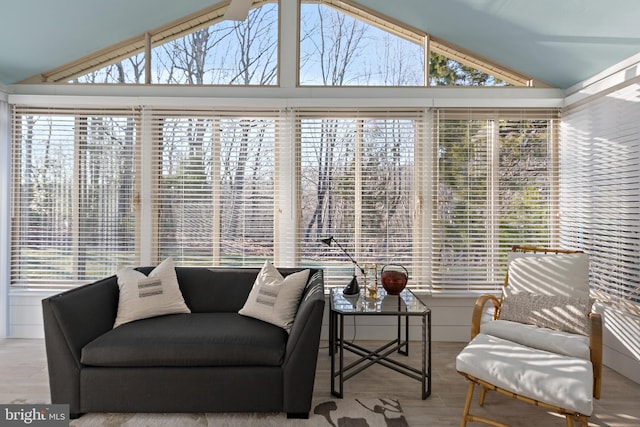 sunroom / solarium featuring vaulted ceiling