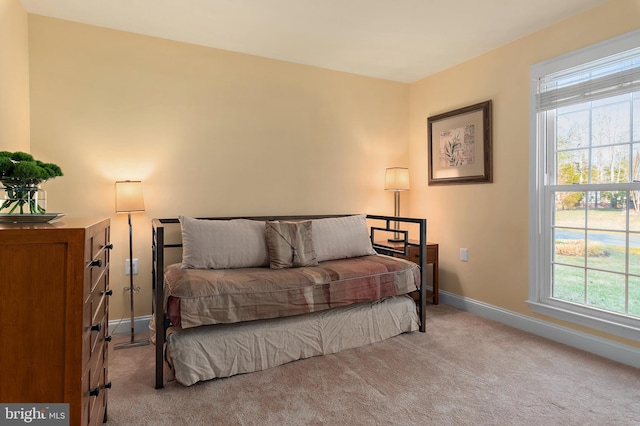 carpeted bedroom with baseboards