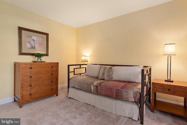 carpeted bedroom with baseboards