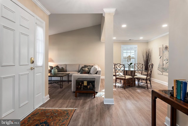 living area featuring baseboards, ornamental molding, wood finished floors, ornate columns, and recessed lighting