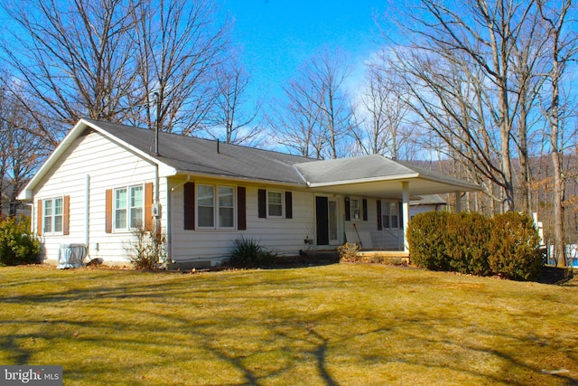 ranch-style house with a front lawn and a carport