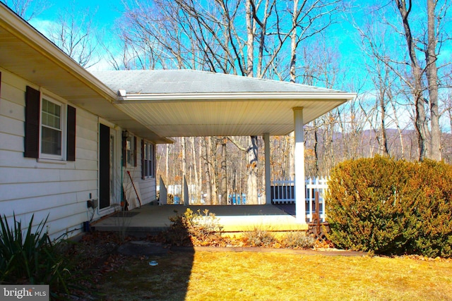 exterior space with covered porch and a lawn