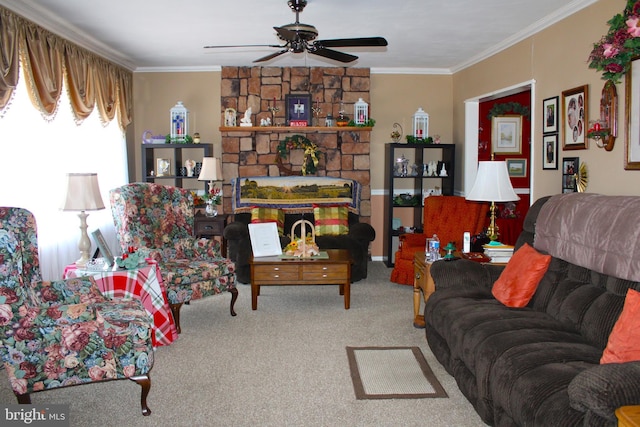 living area with carpet, a fireplace, ornamental molding, and ceiling fan