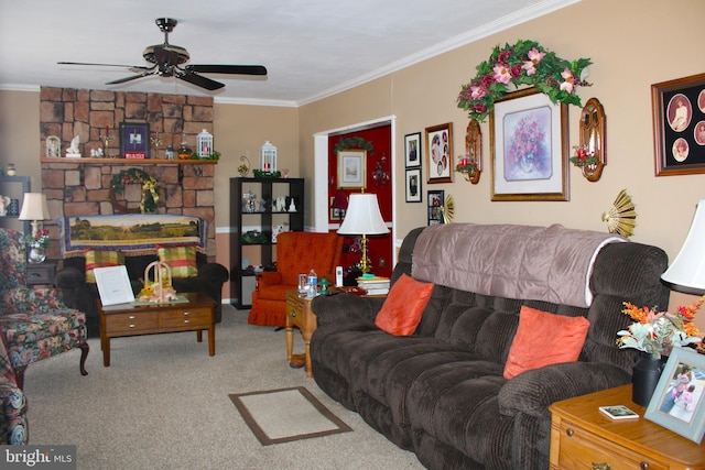 living room with ornamental molding, carpet flooring, and a ceiling fan