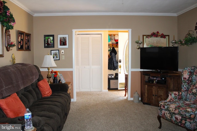 carpeted living room with ornamental molding and baseboards