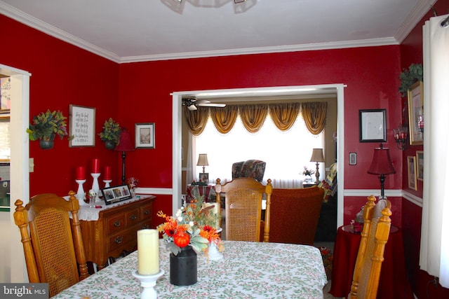 dining room featuring crown molding