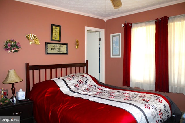 bedroom featuring a ceiling fan and crown molding