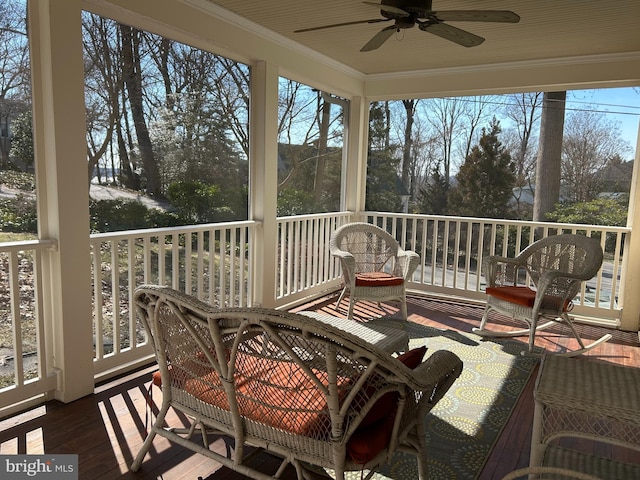 sunroom / solarium with plenty of natural light and a ceiling fan