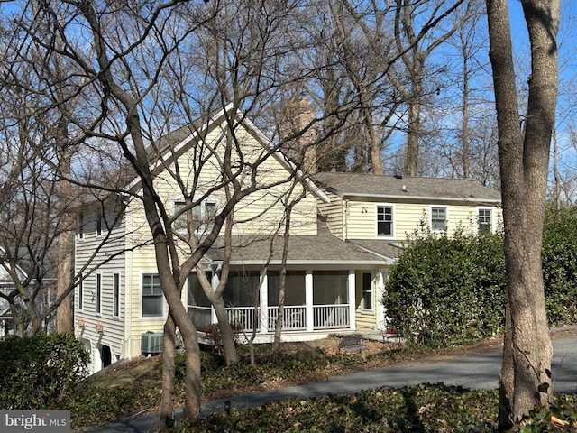 view of front of house with a shingled roof