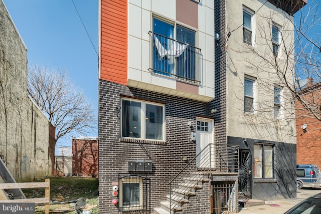 view of front of property featuring brick siding