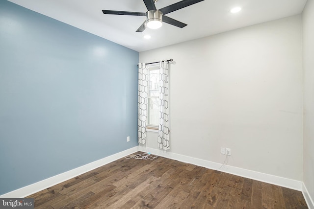 spare room with dark wood-type flooring, recessed lighting, baseboards, and a ceiling fan