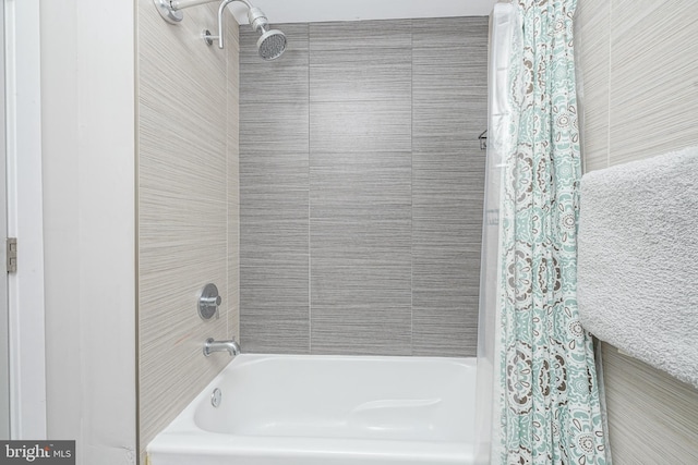 bathroom with shower / bathtub combination with curtain