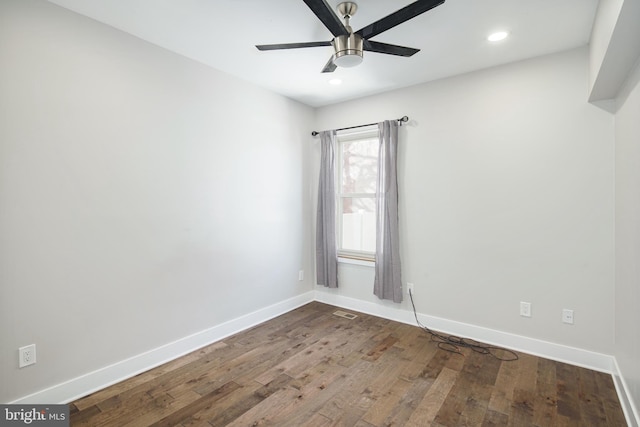 empty room with ceiling fan, recessed lighting, hardwood / wood-style flooring, and baseboards