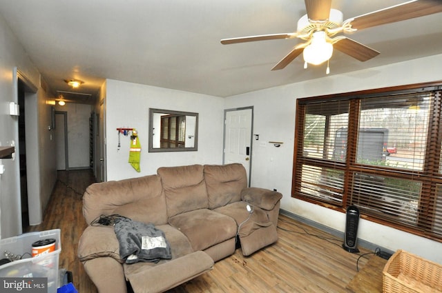 living room featuring ceiling fan and wood finished floors