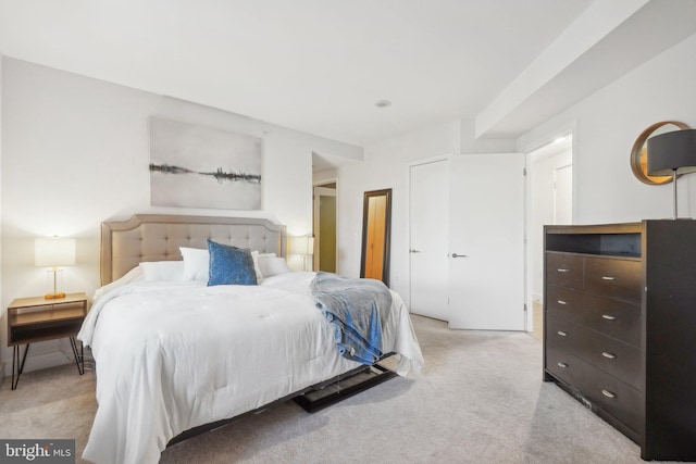 bedroom with light colored carpet