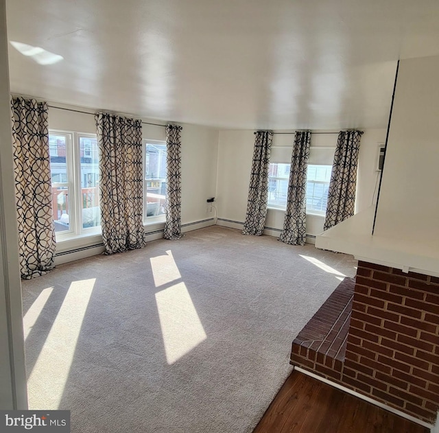 unfurnished living room with carpet