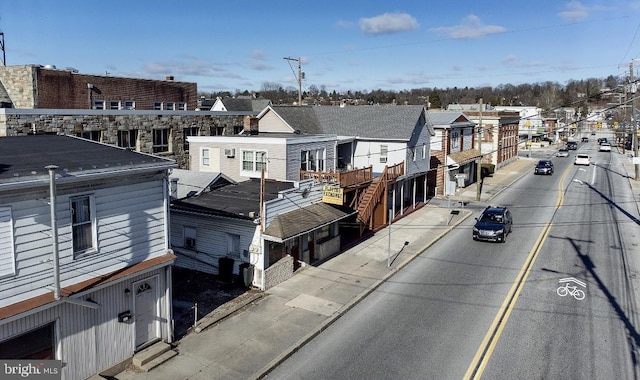 birds eye view of property with a residential view