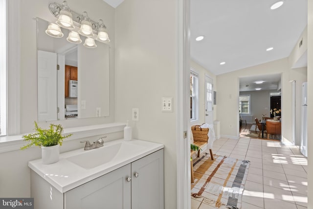 bathroom featuring recessed lighting, vanity, visible vents, vaulted ceiling, and tile patterned floors