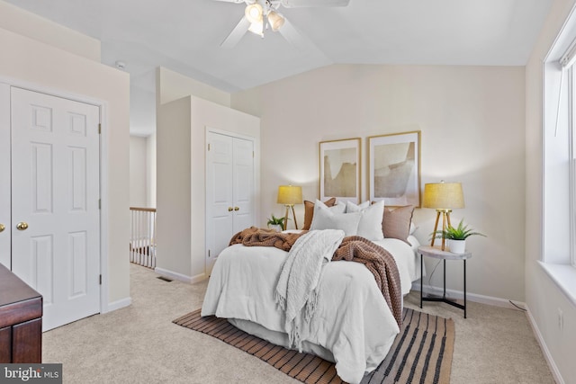 bedroom featuring vaulted ceiling, carpet floors, and baseboards