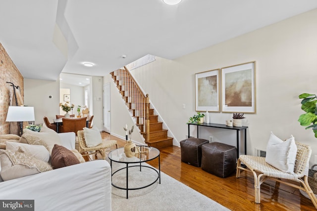 living room featuring stairway and wood finished floors