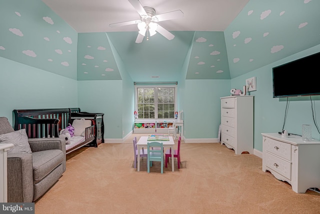 bedroom with light carpet, a crib, and baseboards