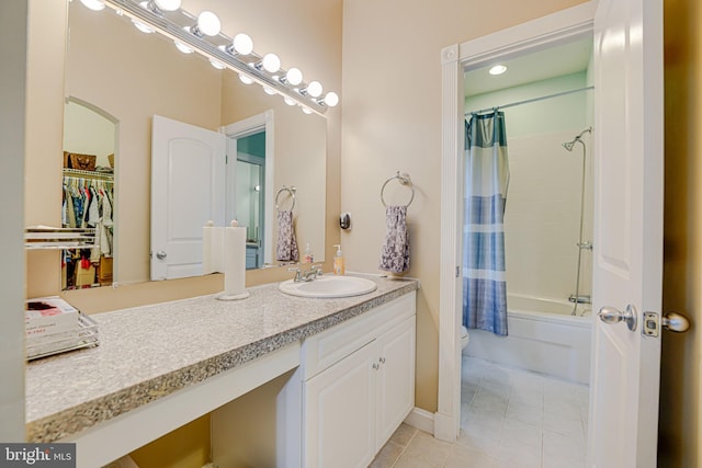 full bath with toilet, shower / bath combo with shower curtain, vanity, and tile patterned floors