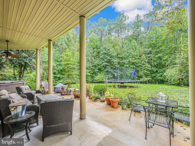 view of patio / terrace featuring outdoor dining space and a trampoline