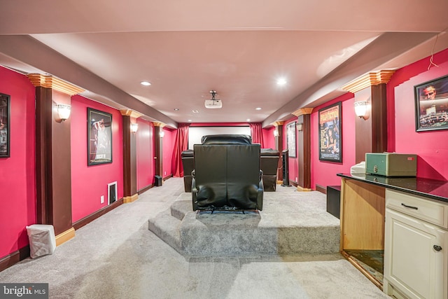 home theater featuring light carpet, recessed lighting, and baseboards