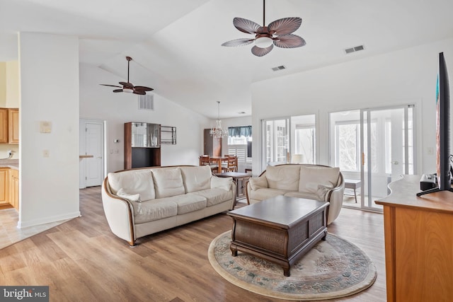 living room featuring ceiling fan, visible vents, and light wood-style flooring