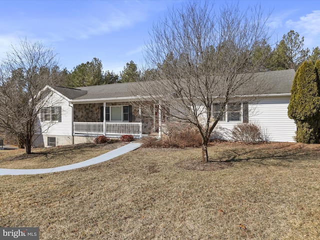 ranch-style house featuring covered porch, stone siding, and a front yard