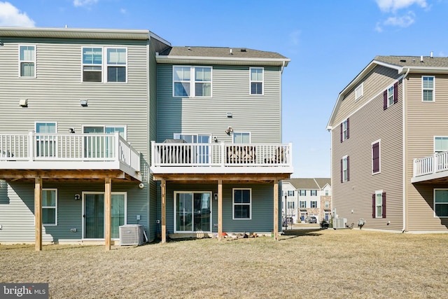 rear view of property with cooling unit