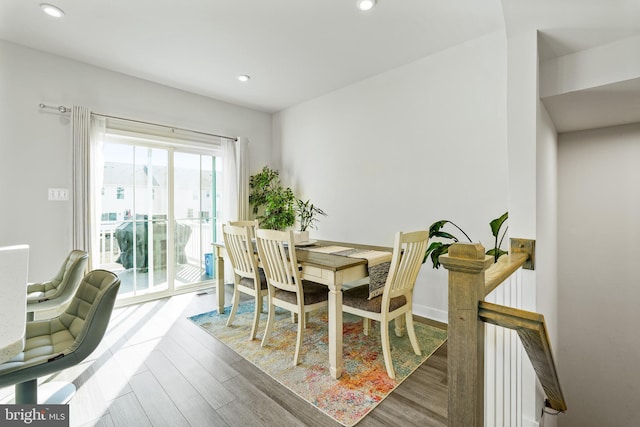 dining area featuring recessed lighting and wood finished floors