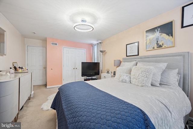 bedroom with light colored carpet, visible vents, and baseboards