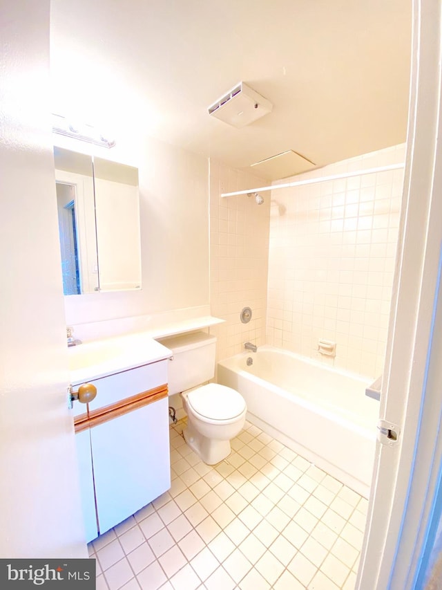 bathroom with toilet, shower / bath combination, vanity, and tile patterned floors