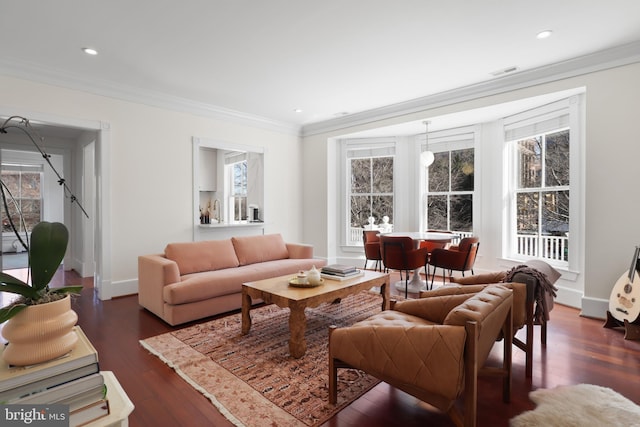 living area featuring baseboards, visible vents, ornamental molding, dark wood-style flooring, and recessed lighting