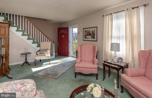 interior space featuring carpet, baseboards, and stairs